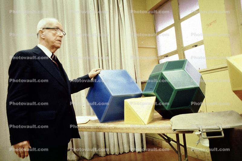 Cube, Bucky preparing polyhedra models, "Conversations with Buckminster Fuller" event, Oakland