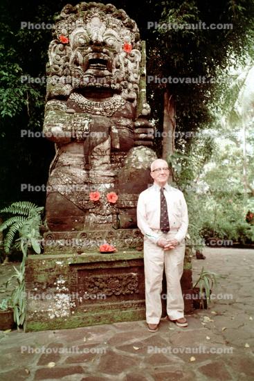 Bucky with a statue in Ubud, Bali, Indonesia