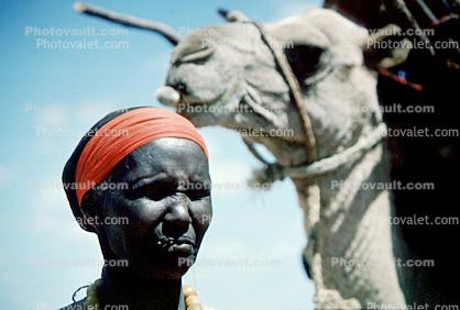 Woman with Camel, Refugee from war, Nomad, Nomadic, Somalia