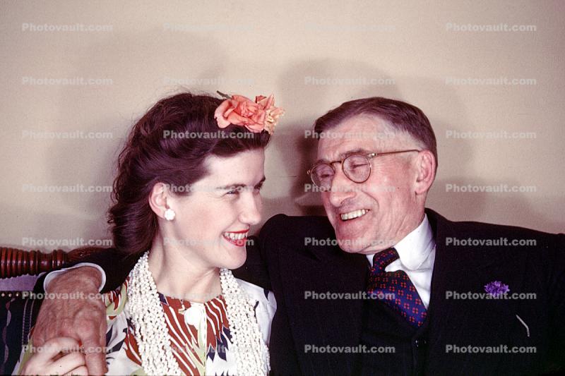 Man and Woman smiling, laughing, flower, 1940s