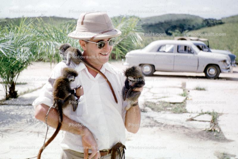 Man holding Monkeys, Yolo Valley, cars, automobiles, vehicles, 1952, 1950s