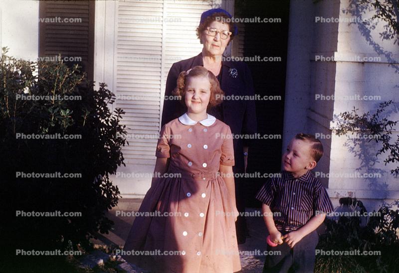 Granmother, Grandaughter, smiles, redhead, girl, woman, boy, 1950s