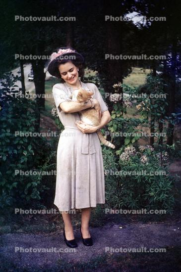Woman with her Cat, hat, smiles, dress, 1950s