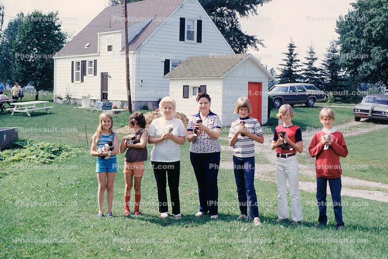 smiling girls, Kitty, kitten, boys, dogs, puppy, backyard, cars, house, Warren Michigan, 1960s
