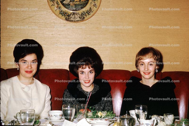 bouffant hairdo, fur coats, dinner, smiling women, April 1965, 1960s