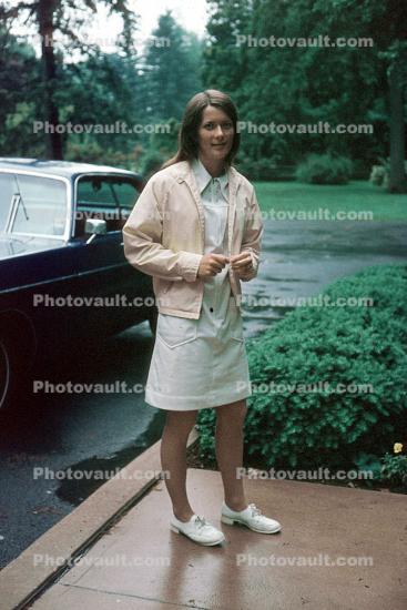 Woman, female, car, rain, tennis shoes, sweater, skirt, June 1974