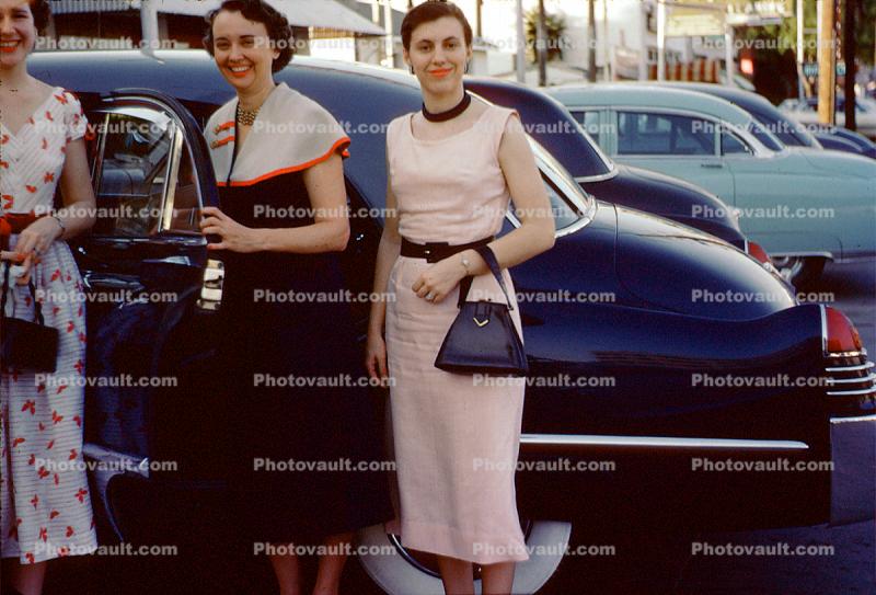 Smiling Ladies, formal dress, purse, car, Cadillac, May 1953, 1950s