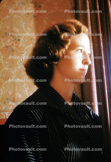 Woman pears deep into, 1950s