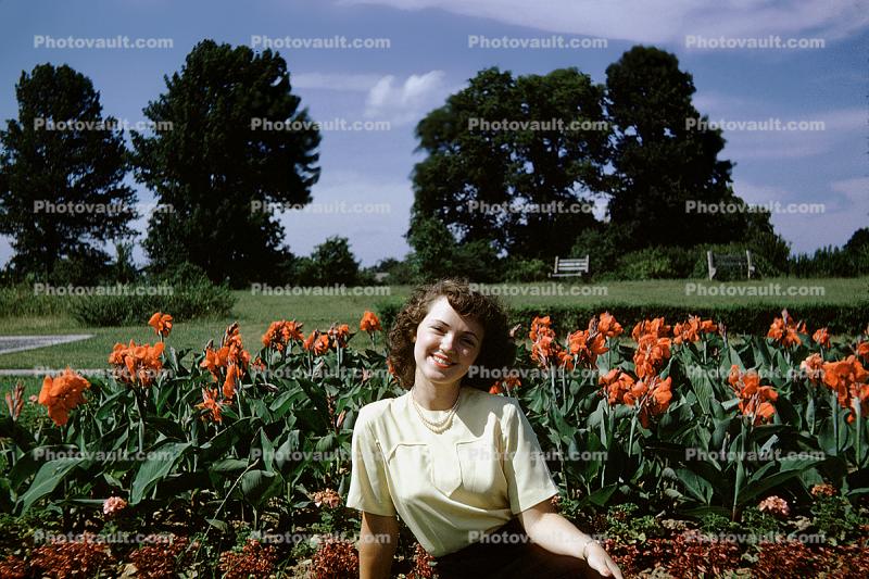 Woman, Smiles, happy-go-lucky, gardens, trees, 1950s