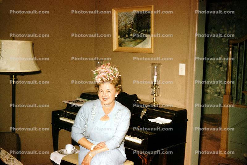 Woman, Upright Piano, Flowery Hat, Bench, Lamp, August 1960, 1960s