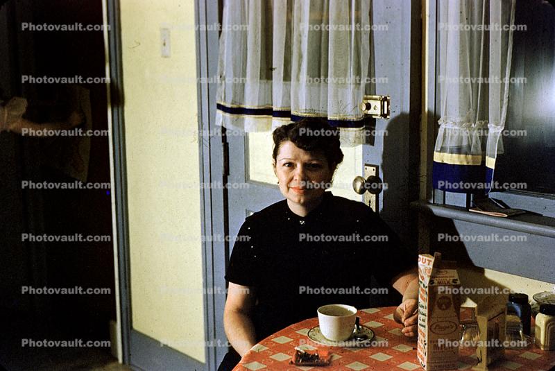 Woman Smiling at the Breakfast Table, Coffee Cup, Milk Container, curtains, 1940s