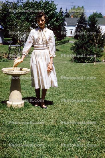 Woman at Water Fountain, Yard, dress, 1950s