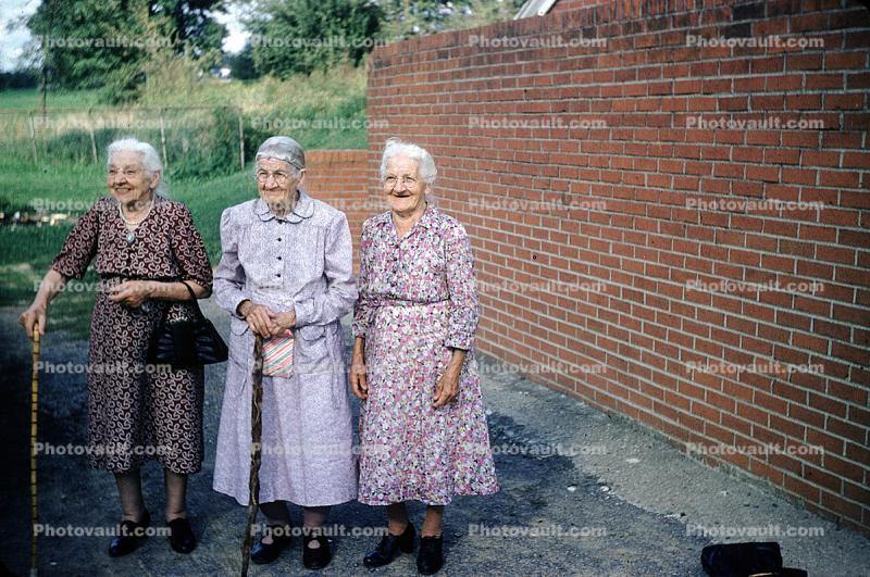 Octogenarians, Grandmother, women, cane, brick wall, 1940s