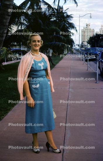 Woman, Sweater, dress, sidewalk, 1950s