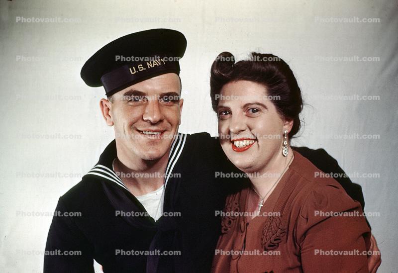 Navy man with Mom, WWII, smiles, 1940s