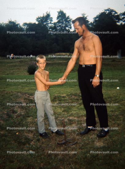 Father and Son shaking hands, 1960s