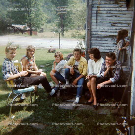 Teenagers hanging out, sitting, women, men, 1960s