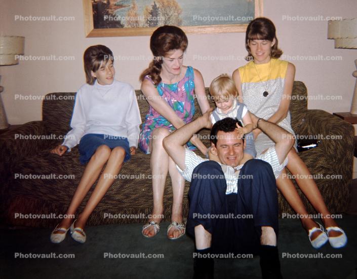 Family group sitting on a sofa