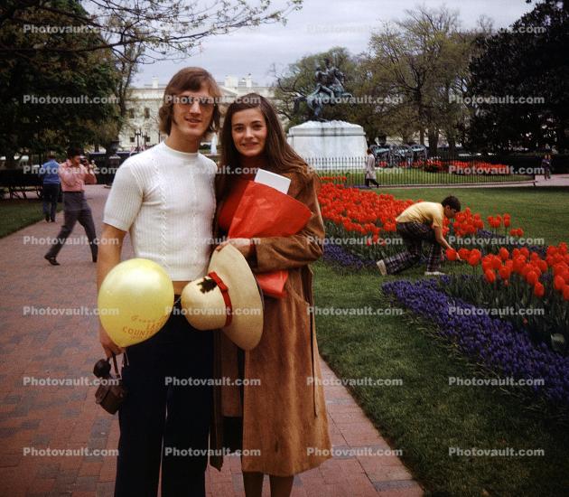 Man, Woman, balloon, hat, coat, tulips, 1970s