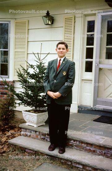 Boy in a suit and tie, formal attire, house