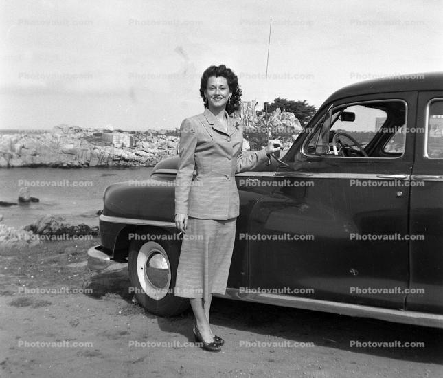 Woman with her Car, smiles, windy, 1940s