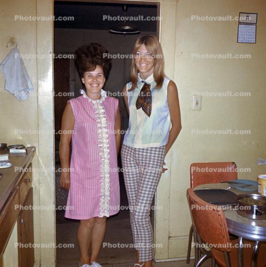 Mother with Teen Daughter, smiles, dress, pants, bouffant hairdo, 1960s