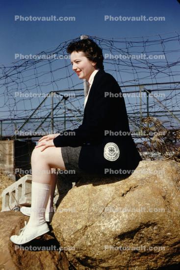 Woman Sitting on a Rock, boulder, Saint Clares Hospital, School of Nursing, 1953