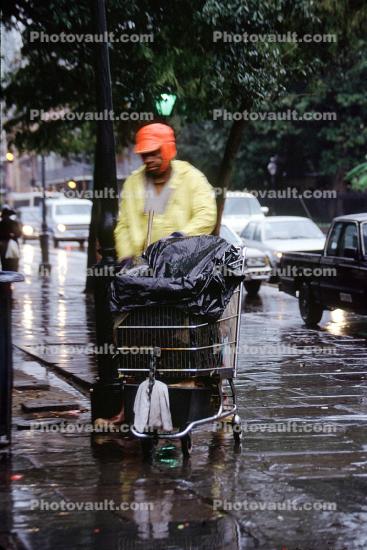 Homeless Man with Shopping Cart, rain, cars, Belongings