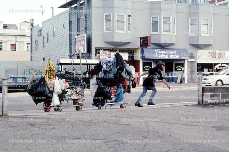 Shopping Cart Train being pulled by a Homeless Man