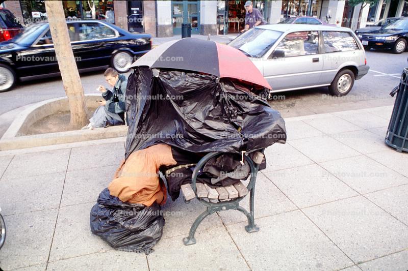 Umbrella and Plastic Home on a Bench, Santa Cruz