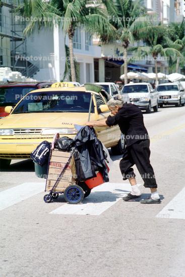 Homeless Woman at a Crosswalk, Taxi Cab, Miami Beach