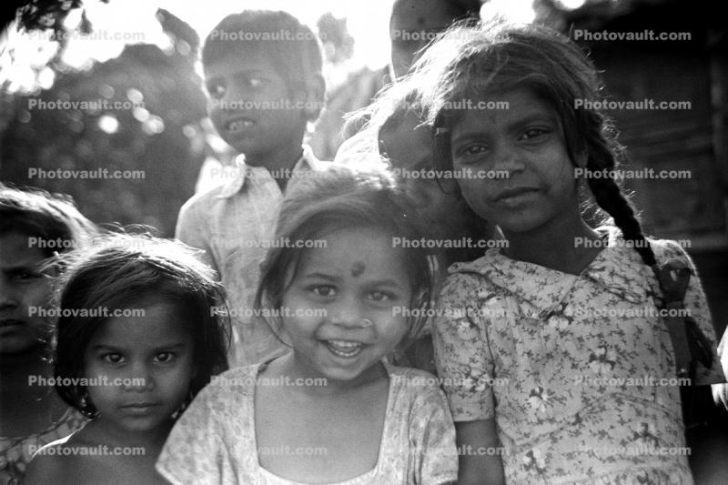 Girls, smiles, pigtails, nosering, slum, Mumbai, India