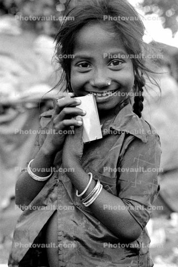 Girl smiles, smiling, shanty town, slum, Mumbai, India