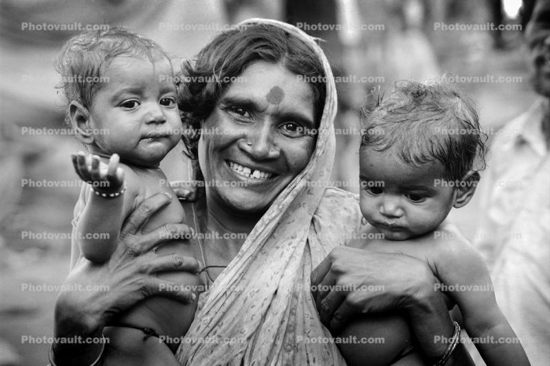 Mother and her two babies, slum, Mumbai, India