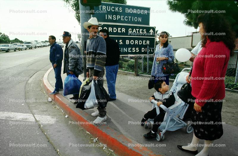 Woman, men, child, stroller, border crossing