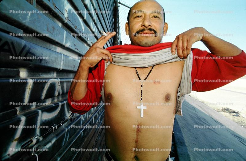 man, cross, chest, Illegal immigrant