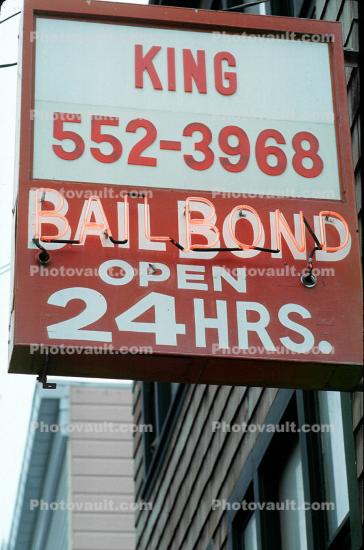 Bail bond, signs, signage, cars, buildings