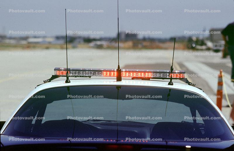 Police Car, flashing lights, antenna, rear window