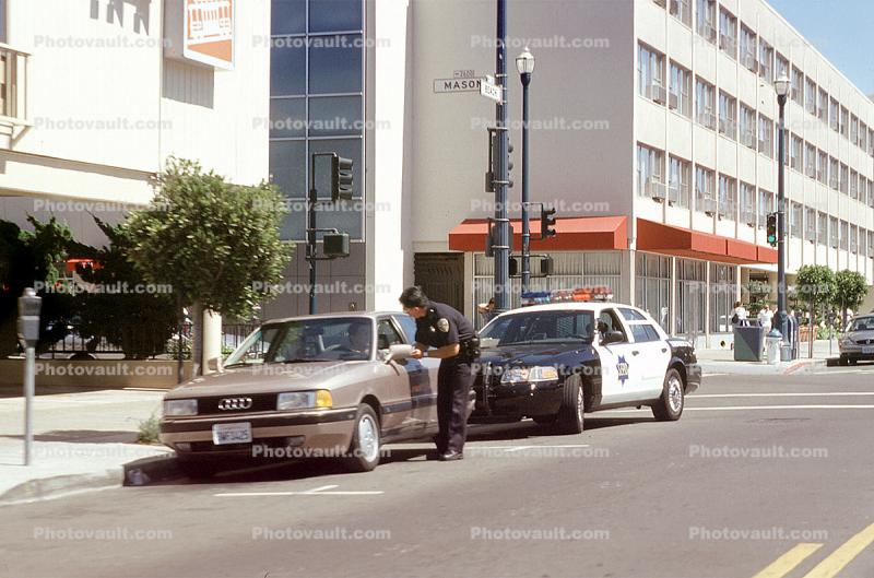 SFPD Police giving out a traffic Ticket, Mason, Car, Audi, buildings, Ford Interceptor