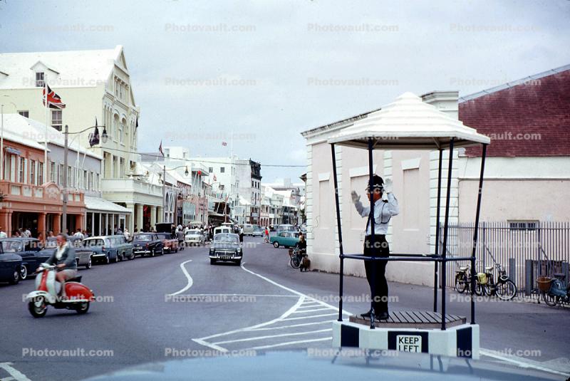 Traffic Cop, Bobby, Vespa Motorscooter, cars, road, shops, building, Hamilton, 1950s