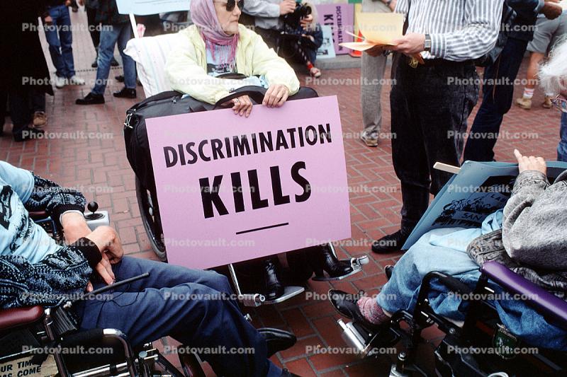 Discrimination Kills, lady in a wheelchair, Earth Day 1990