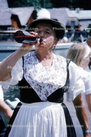 woman drinking from a bottle