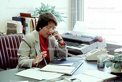 Business Woman, woman on the phone, desk, folder, typewriter, paper, paperwork