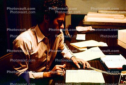  Man, desk, phone, paper, paperwork, 1980s, businessman