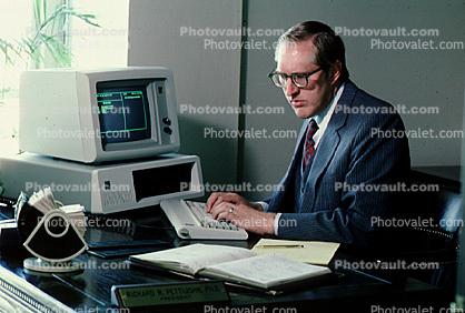 IBM computer, Businessman, Gold Trader, gems, Office, worker, employee, desk, people, broker, stocks and bonds, person, man, rolodex, calendar, 1984, 1980s