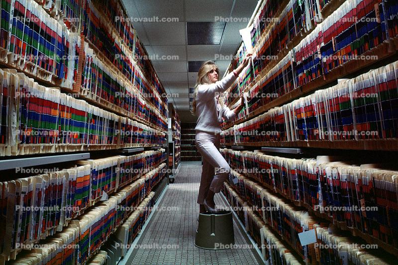 Records Hall, Record Keeping, Files, Women, Retrieval, Hall, Racks, Folders, File Folders, Paper Rows, paperwork, bureaucracy, archive, clutter, documents, dossier, workers, vanishing point, 1980s