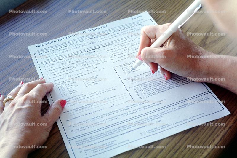 Woman filing out a form, Paper, paperwork, desk, writing