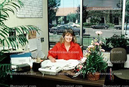 Receptionist, Business Woman, desk, calculator, flowers, desk, window, 1986