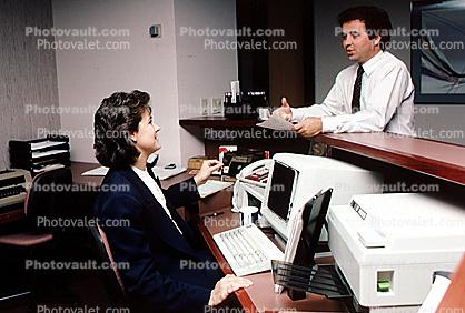 Receptionist, Man, Woman, IBM Computer, laser printer, smiles, desk, typewriter, businessman