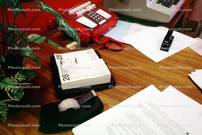 Desk, Phone, Telephone, tape dispenser, day to day calendar, paper